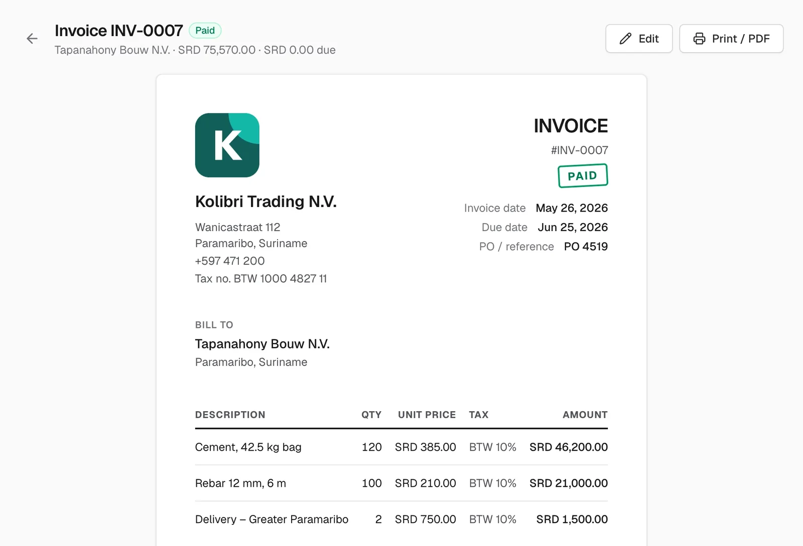 A paid CoreBooks invoice with the business logo and line items with BTW